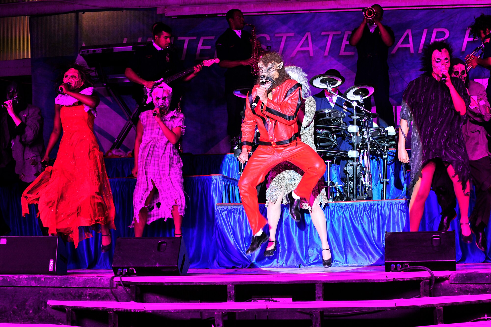 SOUTHWEST ASIA -- Tops In Blue vocalists perform Michael Jackson's "Thriller" during a tribute performance Dec. 20, 2012 at the 380th Air Expeditionary Wing. During their 2012 tour, "Listen," the group has performed more than 140 shows, including 14 performances in the area of responsibility for deployed members. (U.S. Air Force photo/Tech. Sgt. Christina M. Styer) (RELEASED)