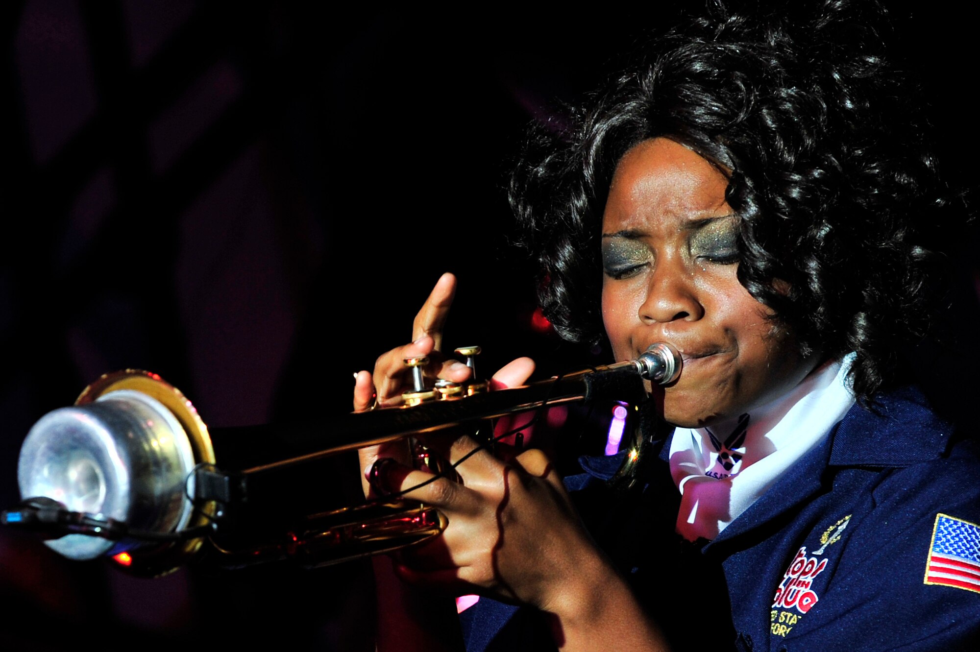 SOUTHWEST ASIA -- U.S. Air Force Airman 1st Class Jessica Pitts, Tops In Blue trumpet player, performs a solo for the audience during a performance Dec. 20, 2012. Tops In Blue performed at the 380th Air Expeditionary Wing, as well as 13 other shows, spanning every Air Force base in the area of responsibility during their 2012 tour, "Listen." (U.S. Air Force photo/Tech. Sgt. Christina M. Styer) (RELEASED)