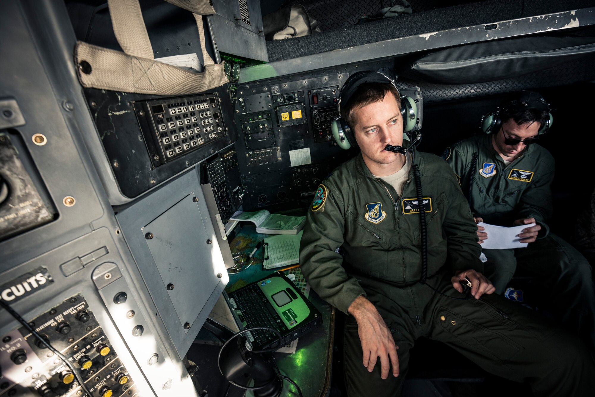 OVER MICRONESIA -- Capt. Matt Pate, 36th Airlift Squadron navigator, watches the horizon over Micronesia, Dec. 15, 2012. The crew flew air drop missions over eight days to deliver donated supplies to more than 30,000 remote islanders as part of Operation Christmas Drop. (U.S. Air Force photo by Tech. Sgt. Samuel Morse)