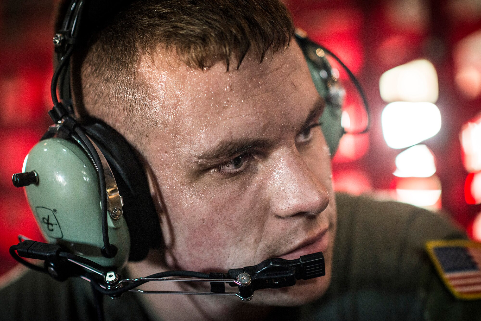 ANDERSEN AIR FORCE BASE, Guam -- Senior Airman Timothy Oberman, loadmaster with the 36th Airlift Squadron, waits for takeoff in a C-130 Hercules at Andersen Air Force Base, Guam, Dec. 12, 2012. The crew flew donated supplies to the islands of Micronesia as part of Operation Christmas Drop. (U.S. Air Force photo by Tech. Sgt. Samuel Morse)