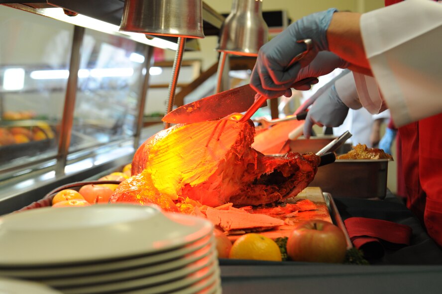 A turkey is carved for a Christmas meal at the Marshal Dining Facility on Kadena Air Base, Japan, Dec. 25, 2012. The meal is an annual tradition where Kadena's leadership gives back to the Airmen by serving them various Christmas dishes and wishing them a happy holiday. (U.S. Air Force photo/Airman 1st Class Malia Jenkins)