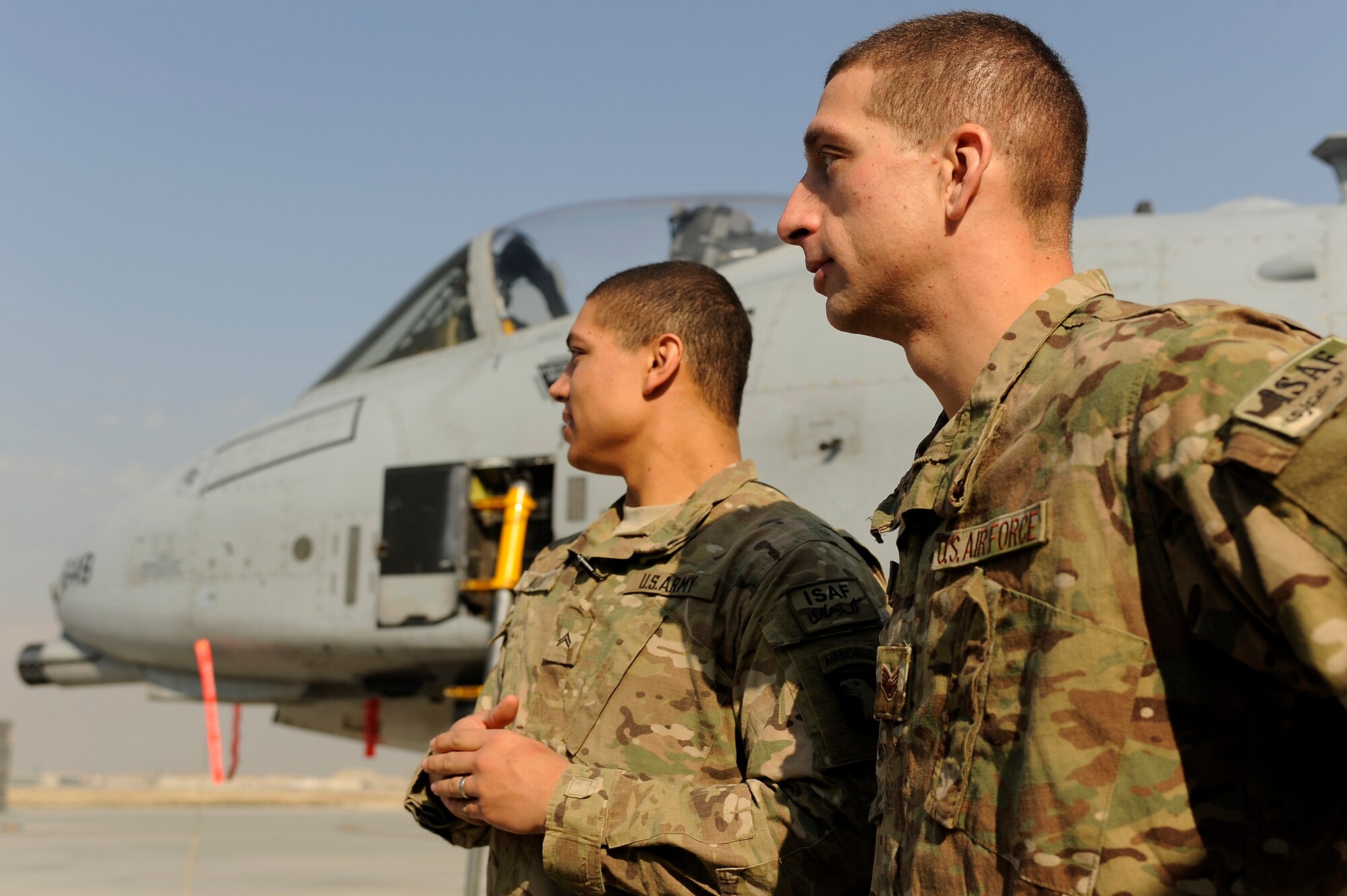 BAGRAM AIRFIELD, Afghanistan - Staff Sgt. Derek Allen, 455th Expeditionary Maintenance Squadron and brother U.S. Army Cpl. Greg Allen, 101st Airborne Division, admire A-10 Thunderbolt II aircraft on the flightline here, Dec. 23, 2012. The brothers spent the holidays together for the first time since 2009 after the A-10 Thunderbolt II aircraft Derek maintains provided vital combat support for Greg and his fellow soldiers. (U.S. Air Force photo/Master Sgt. Jun Kim)