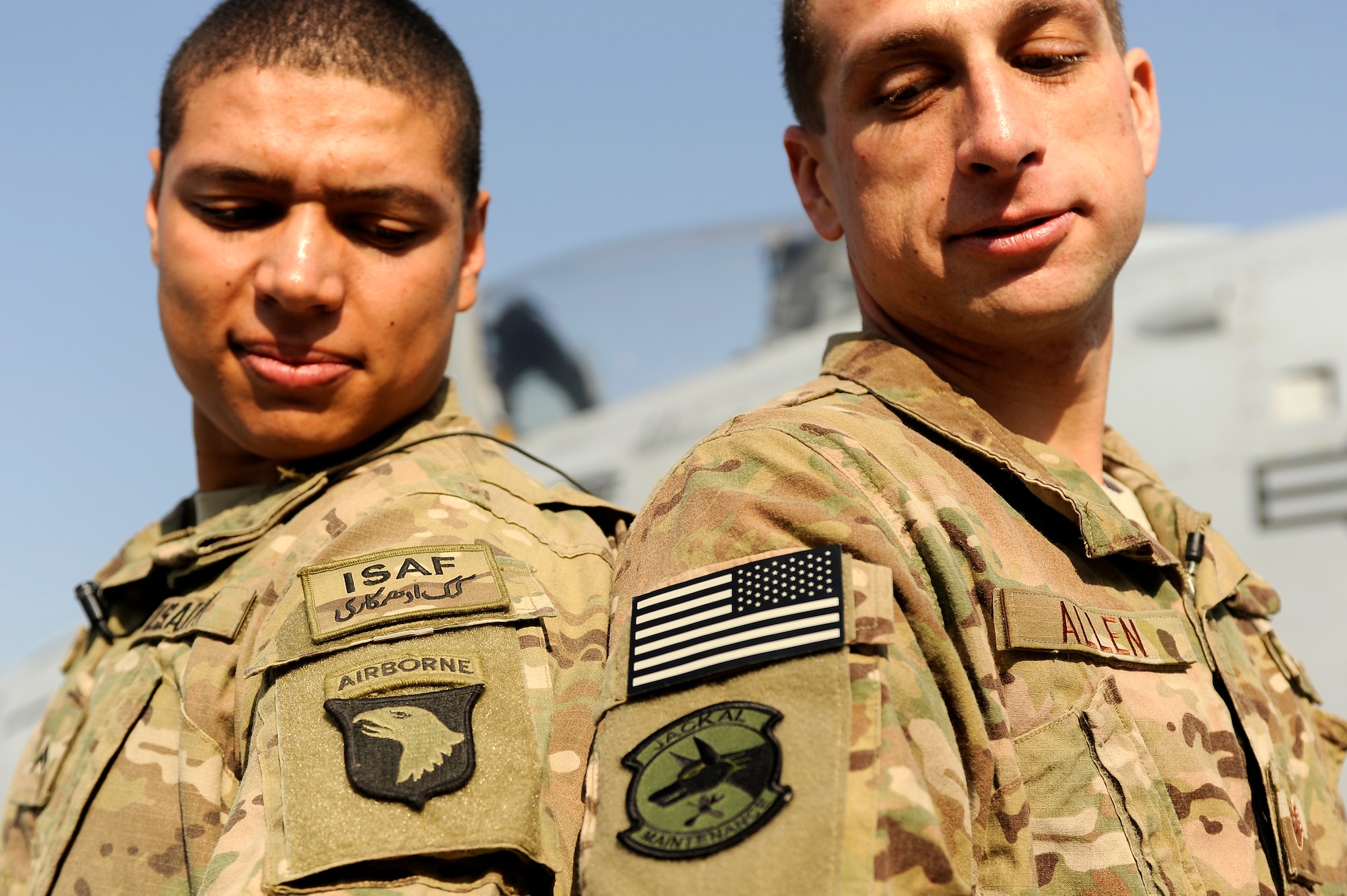 BAGRAM AIRFIELD, Afghanistan - Staff Sgt. Derek Allen, 455th Expeditionary Maintenance Squadron and brother U.S. Army Cpl. Greg Allen, 101st Airborne Division, compare unit patches on the flightline here, Dec. 23, 2012. The brothers spent the holidays together for the first time since 2009 after the A-10 Thunderbolt II aircraft Derek maintains provided vital combat support for Greg and his fellow soldiers. (U.S. Air Force photo/Master Sgt. Jun Kim)