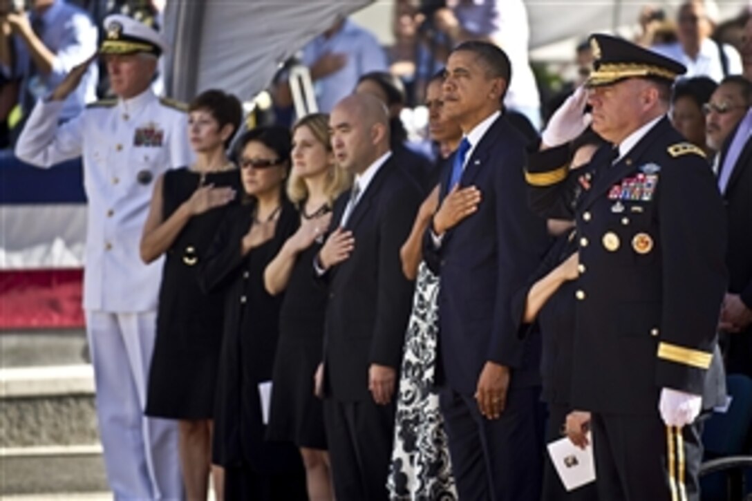 President Barack Obama; First Lady Michelle Obama; Navy Adm. Samuel J. Locklear III, commander, U.S. Pacific Command; Army Lt. Gen. Francis J. Wiercinski, commanding general, U.S. Army Pacific; and family members of U.S. Sen. Daniel K. Inouye pay tribute to the senator from Hawaii during a service at the National Memorial Cemetery of the Pacific in Honolulu, Dec. 23, 2012. Inouye, a World War II veteran and Medal of Honor recipient, died Dec. 17.