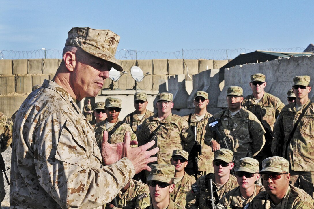 Gen. John R. Allen, International Security Assistance Force commander, speaks with troops gathered at Combat Outpost Jannat in southern Afghanistan on Christmas Day.