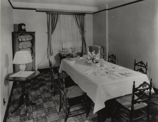 A dining room stands decorated for a Christmas meal at Rapid City Army Air Base, S.D., during World War II. Throughout the turmoil and tragic events surrounding WWII, Airmen of RCAAB and their families proved that no matter what was unfolding around the globe, nothing could steal their holiday cheer. (U.S. Air Force courtesy photo/Released) 