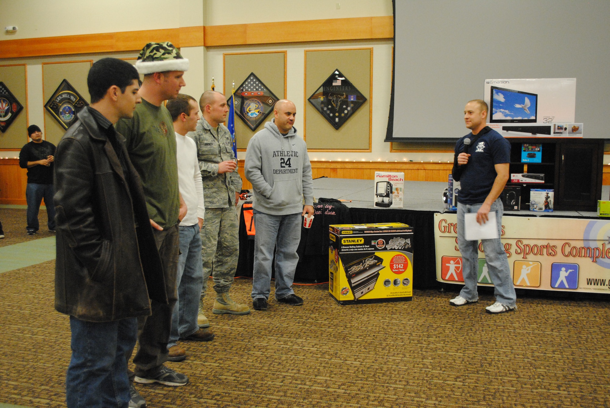 Master Sgt. William Baccus, 341st Civil Engineer Squadron first sergeant, right, quizzes owners of diesel vehicles about their vehicles. Baccus, along with Master Sgt. Colin Crandall, 341st Medical Group first sergeant and Malmstrom’s first sergeants, organized the wrap-up party, which brought in more than 250 attendees. (U.S. Air Force photo/Airman 1st Class Katrina Heikkinen)