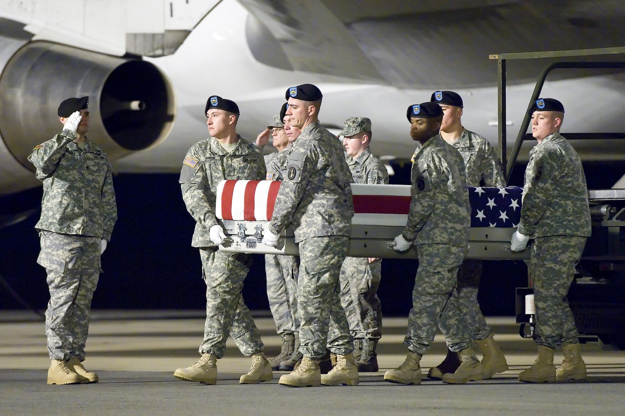 A U.S. Army carry team transfers the remains of Army Sgt. Enrique Mondragon, of The Colony, Texas, at Dover Air Force Base, Del., Dec. 25, 2012. Mondragon was assigned to Headquarters and Headquarters Detachment, 173rd Special Troops Battalion, 173rd Airborne Brigade Combat Team, Bamberg, Germany. (U.S. Air Force photo/Roland Balik)