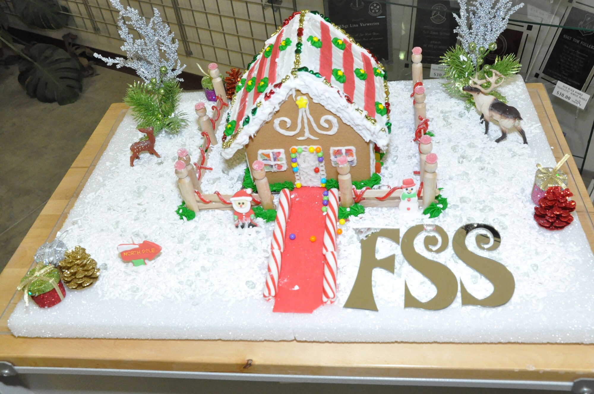 GOODFELLOW AIR FORCE BASE, Texas – The 17th Force Support Squadron competes in a gingerbread house contest held at the Arts and Craft Center here Dec. 19. When final vote tally was completed at the Norma Brown building here Dec. 21, 17 FSS claimed victory over all the other houses, winning them a pizza party. (U.S. Air Force photo/ Airman 1st Class Joshua Edwards)
