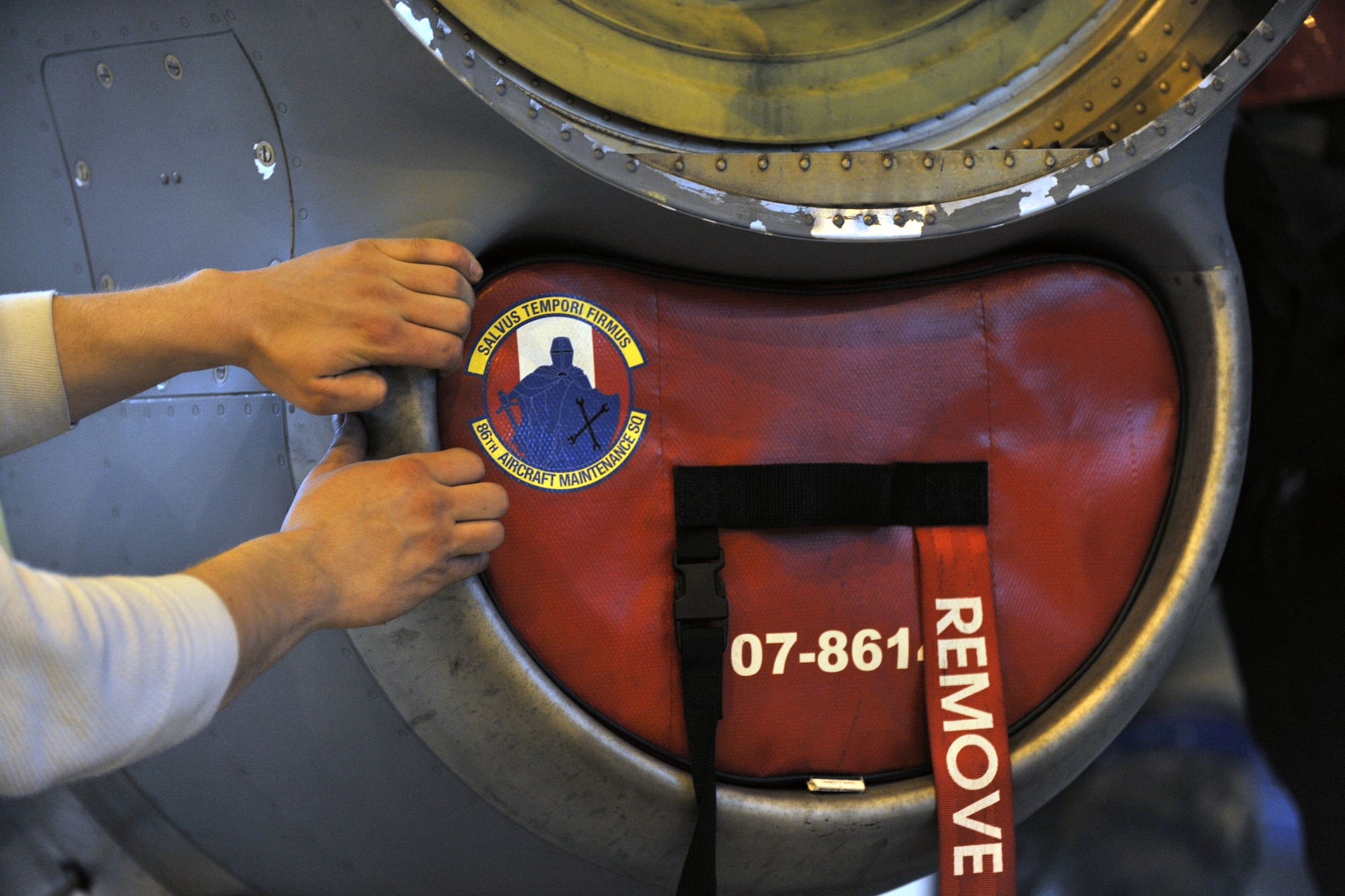 Members of the 86th Aircraft Maintenance Squadron prepare to change an engine on a C-130J, Ramstein Air Base, Germany, Jan. 18, 2012. The engine was damaged by a metal fragment and will take around eight hours to repair. (U.S. Air Force photo/Airman 1st Class Caitlin O-Neil-McKeown)