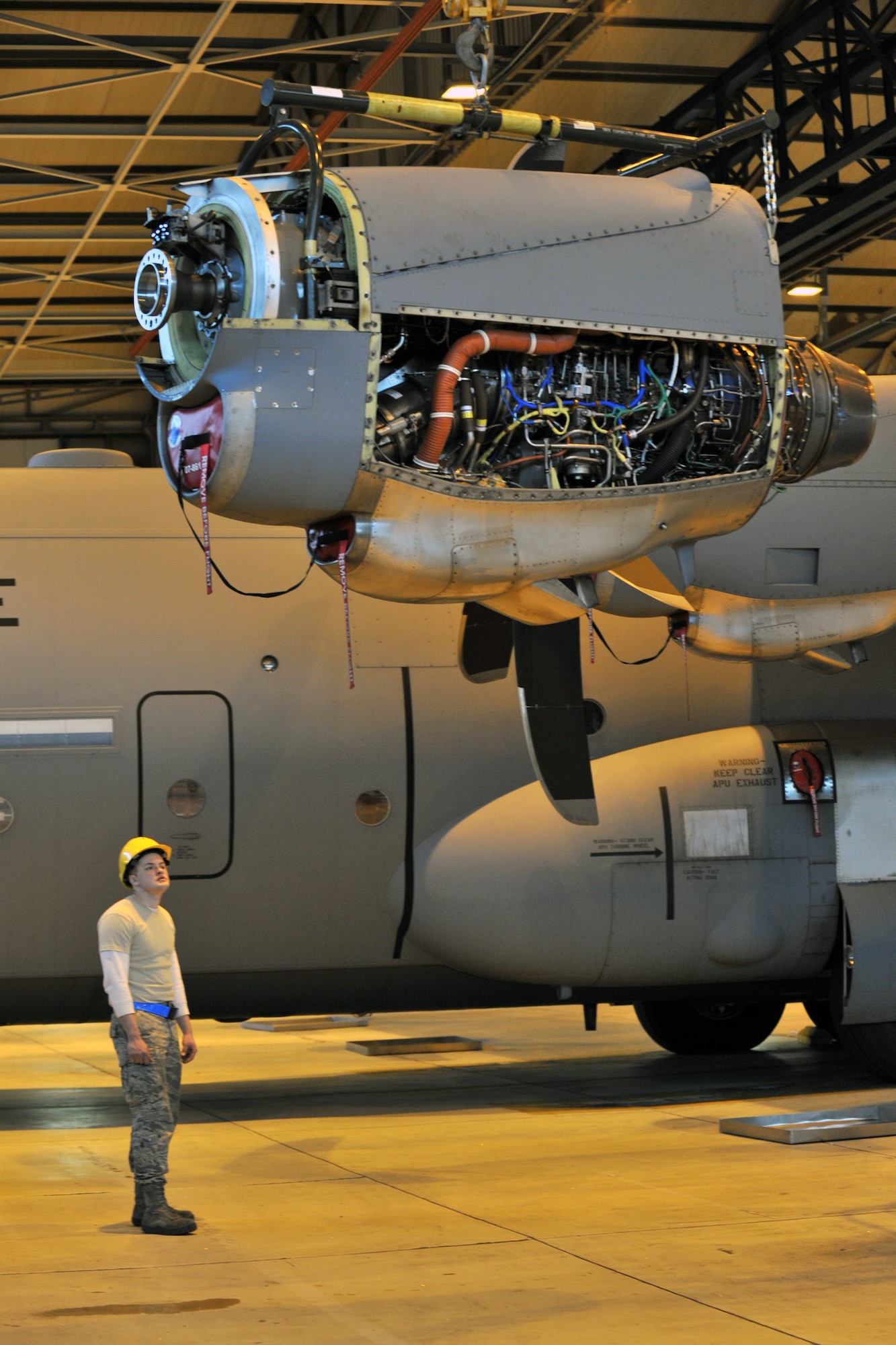 Members of the 86th Aircraft Maintenance Squadron prepare to change an engine on a C-130J, Ramstein Air Base, Germany, Jan. 18, 2012. The engine was damaged by a metal fragment and will take around eight hours to repair. (U.S. Air Force photo/Airman 1st Class Caitlin O-Neil-McKeown)