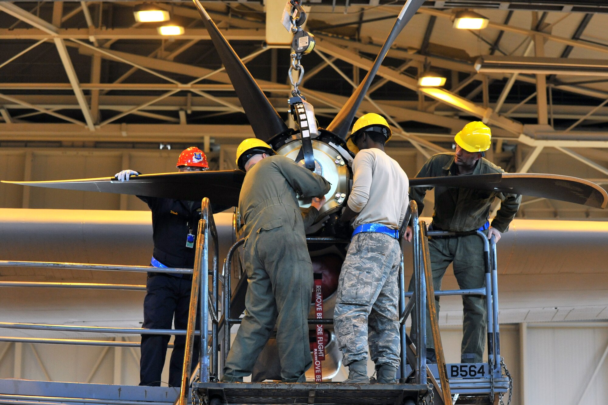 Members of the 86th Aircraft Maintenance Squadron prepare to change an engine on a C-130J, Ramstein Air Base, Germany, Jan. 18, 2012. The engine was damaged by a metal fragment and will take around eight hours to repair. (U.S. Air Force photo/Airman 1st Class Caitlin O-Neil-McKeown)
