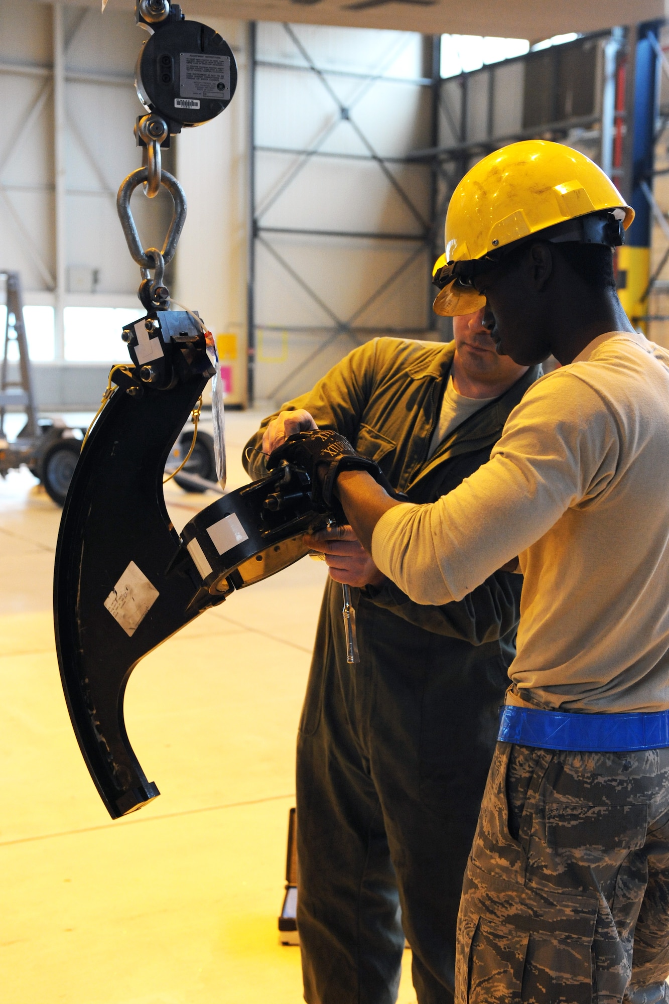 Members of the 86th Aircraft Maintenance Squadron prepare to change an engine on a C-130J, Ramstein Air Base, Germany, Jan. 18, 2012. The engine was damaged by a metal fragment and will take around eight hours to repair. (U.S. Air Force photo/Airman 1st Class Caitlin O-Neil-McKeown)