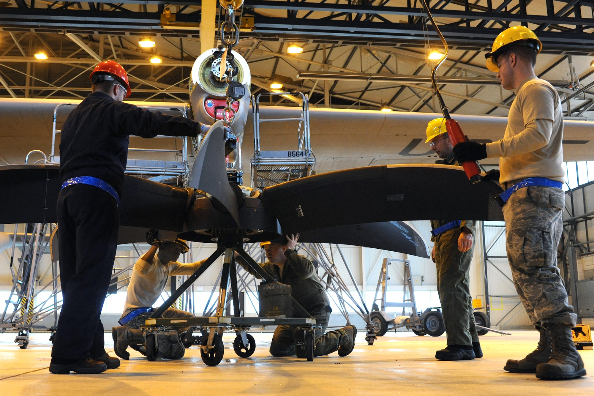 Members of the 86th Aircraft Maintenance Squadron prepare to change an engine on a C-130J, Ramstein Air Base, Germany, Jan. 18, 2012. The engine was damaged by a metal fragment and will take around eight hours to repair. (U.S. Air Force photo/Airman 1st Class Caitlin O-Neil-McKeown)
