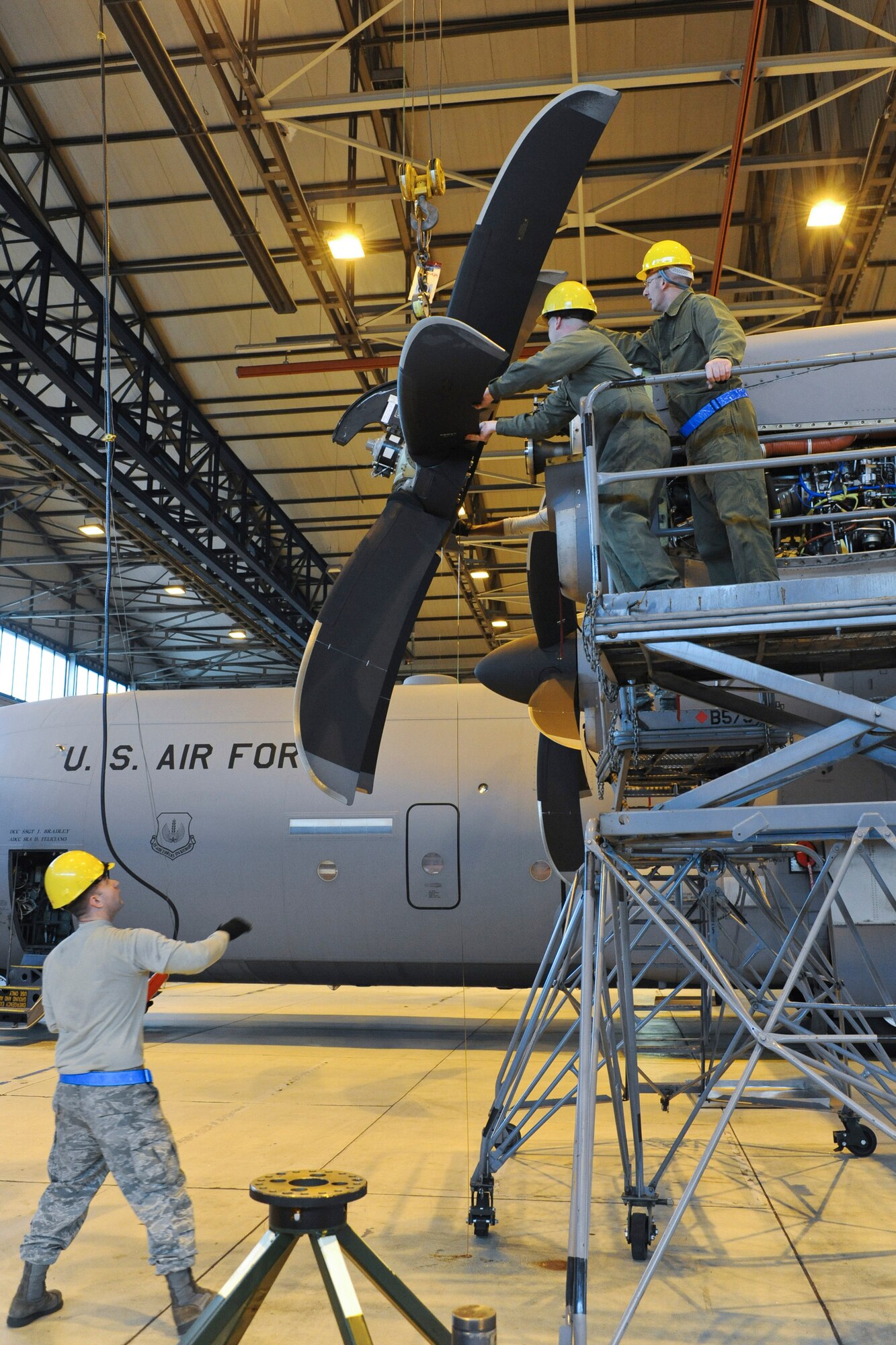 Members of the 86th Aircraft Maintenance Squadron prepare to change an engine on a C-130J, Ramstein Air Base, Germany, Jan. 18, 2012. The engine was damaged by a metal fragment and will take around eight hours to repair. (U.S. Air Force photo/Airman 1st Class Caitlin O-Neil-McKeown)