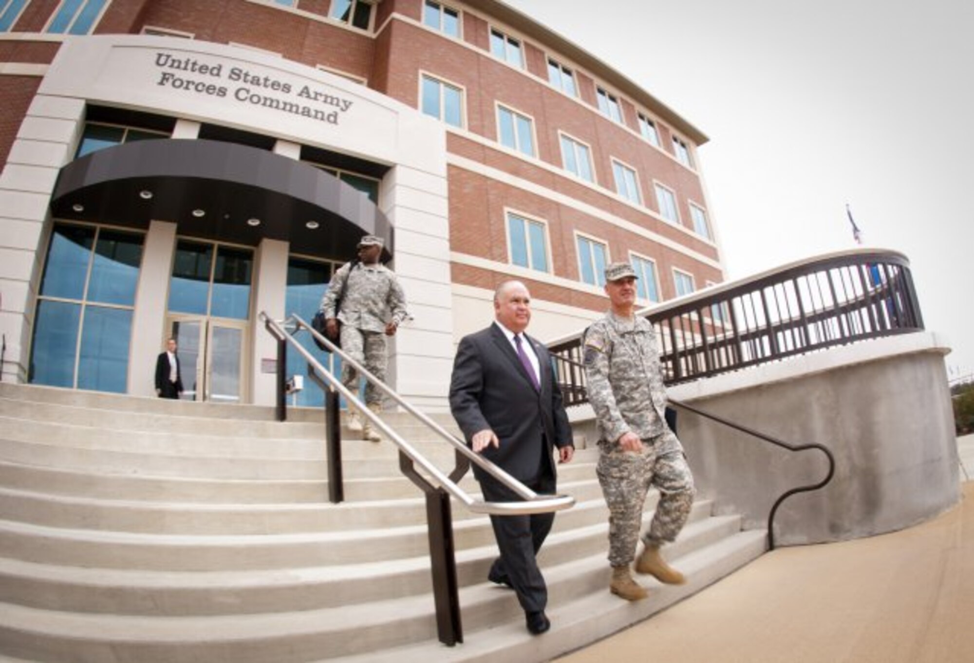 Under Secretary of the Army Joseph W. Westphal begins a tour of Fort Bragg hosted by FORSCOM Commander Gen. David M. Rodriguez (to his left) just outside the U.S. Army Forces Command headquarters after a senior level brief of the state of Army, Dec. 4, 2012. (U.S. Army courtesy photo/Released)