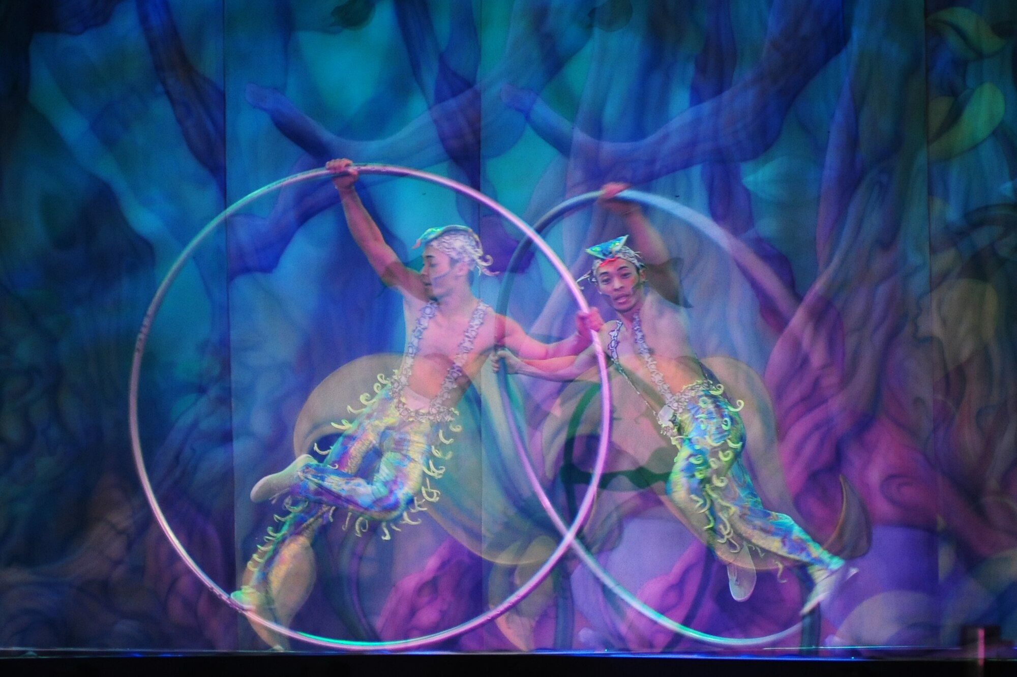 Members of Team Ramstein waited an hour in the cold for a warm seat to view Cirque Dreams "Jungle Fantasy” World Tour performance at Ramstein Air Base, Germany, Feb. 17, 2012.  The hour and a half show featured vibrant costumes, amazing acts of physical strength and skill, aerial acts, tumblers, jugglers, gymnasts, contortionists and jokesters. Cirque Dreams partnered with Armed Forces Entertainment to perform "Jungle Fantasy" at 17 military installations in 10 different countries through Asia and Europe.  (U.S. Air Force photo/Senior Airman Aaron-Forrest Wainwright)