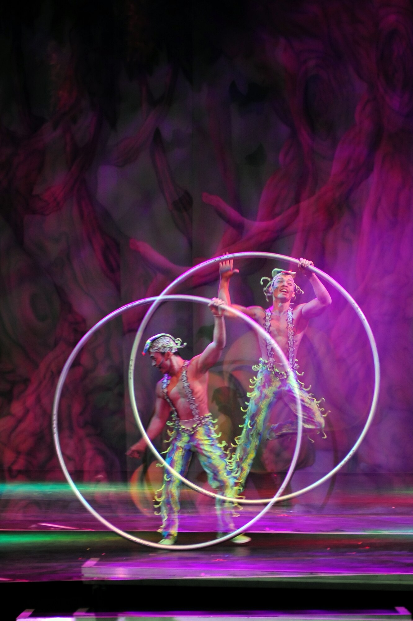 Members of Team Ramstein waited an hour in the cold for a warm seat to view Cirque Dreams "Jungle Fantasy” World Tour performance at Ramstein Air Base, Germany, Feb. 17, 2012.  The hour and a half show featured vibrant costumes, amazing acts of physical strength and skill, aerial acts, tumblers, jugglers, gymnasts, contortionists and jokesters. Cirque Dreams partnered with Armed Forces Entertainment to perform "Jungle Fantasy" at 17 military installations in 10 different countries through Asia and Europe.  (U.S. Air Force photo/Senior Airman Aaron-Forrest Wainwright)