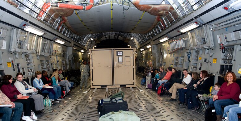 Members of the Incirlik community await instructions aboard a C-17 Globemaster during a noncombatant evacuation operation exercise Dec. 13, 2012, at Incirlik Air Base, Turkey. More than 75 spouses, children and other non-mission essential civilians attended the event, to get first-hand experience of the noncombatant evacuation process. During a real-world evacuation, family members and non-mission essential Department of Defense personnel would complete the process and be en-route to a safe location within 48 hours of notification. (U.S. Air Force photo by Staff Sgt. Marissa Tucker/Released)