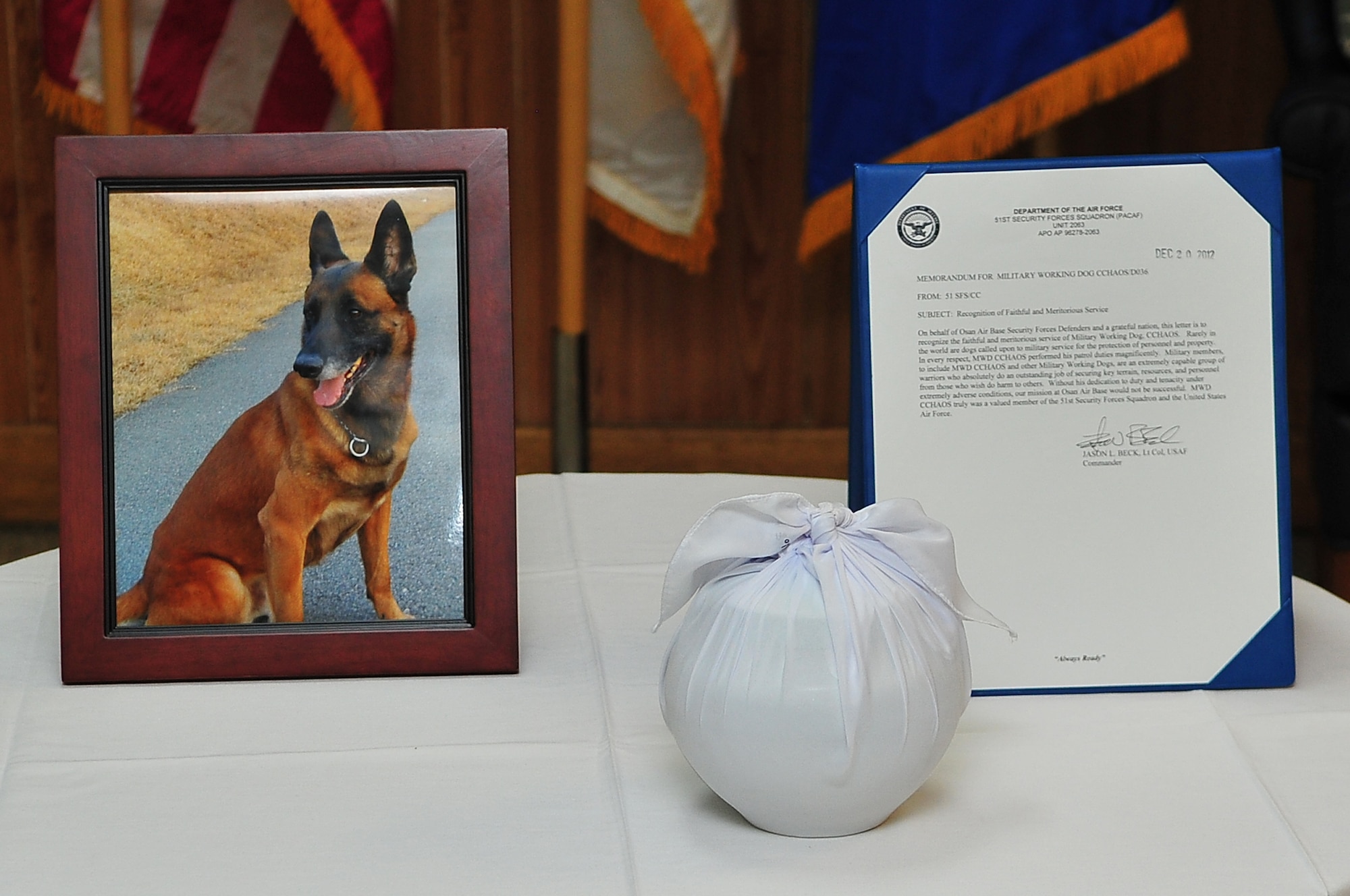 Military Working Dog CChaos is remembered during a memorial service recognizing his contributions to the 51st Security Forces Squadron Dec. 20. CChaos was a military K-9 assigned to Osan for 10 years before passing on Nov. 2, 2012. (U.S. Air Force photo/Tech. Sgt. Raymond Mills) 