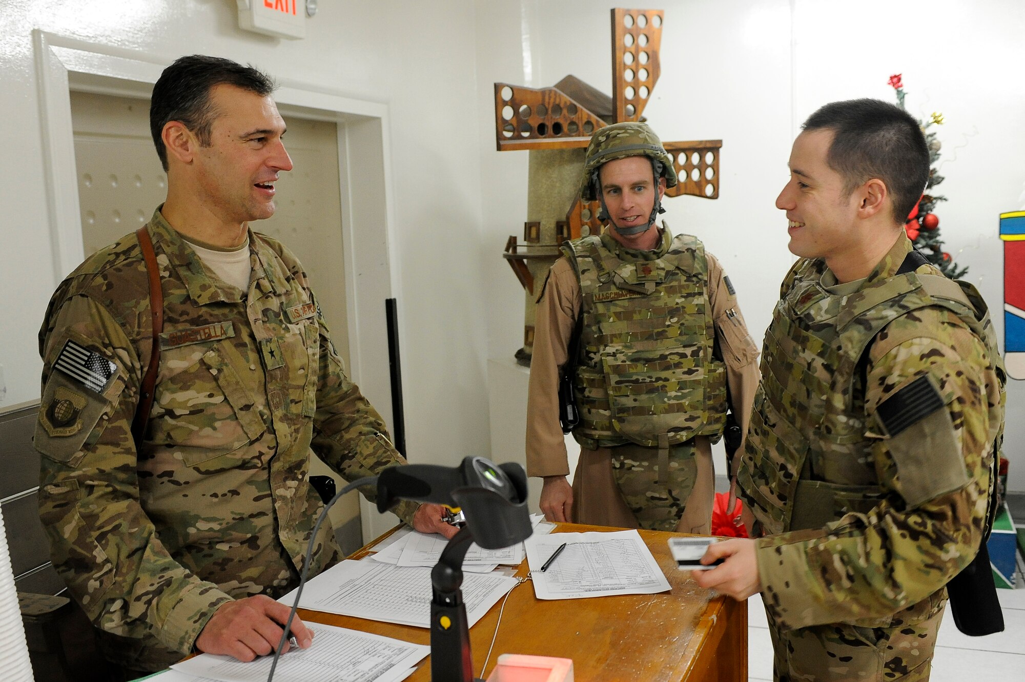 Brig. Gen. Joseph Guastella, 455th Air Expeditionary Wing commander, greets servicemembers at the dining facility during a Christmas Day celebration on Bagram Airfield, Afghanistan, Dec. 25, 2012. Squadron and wing leadership served meals throughout the holidays to boost the morale of the servicemen and women. (U.S. Air Force photo/Senior Airman Chris Willis)