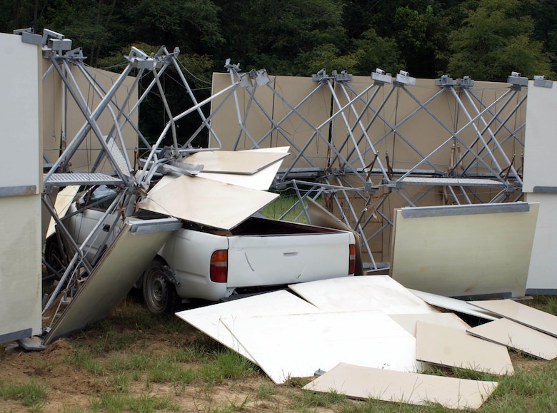 Post-crash view of the truck stopped by the improved Modular Protective System Perimeter Wall.