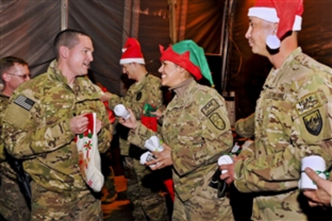 U.S. Air Force Tech. Sgt. Betzy Bonilla fills a Christmas stocking on Camp Eggers in Kabul, Afghanistan, Dec. 23, 2012. Bonilla is assigned to NATO Training Mission-Afghanistan.