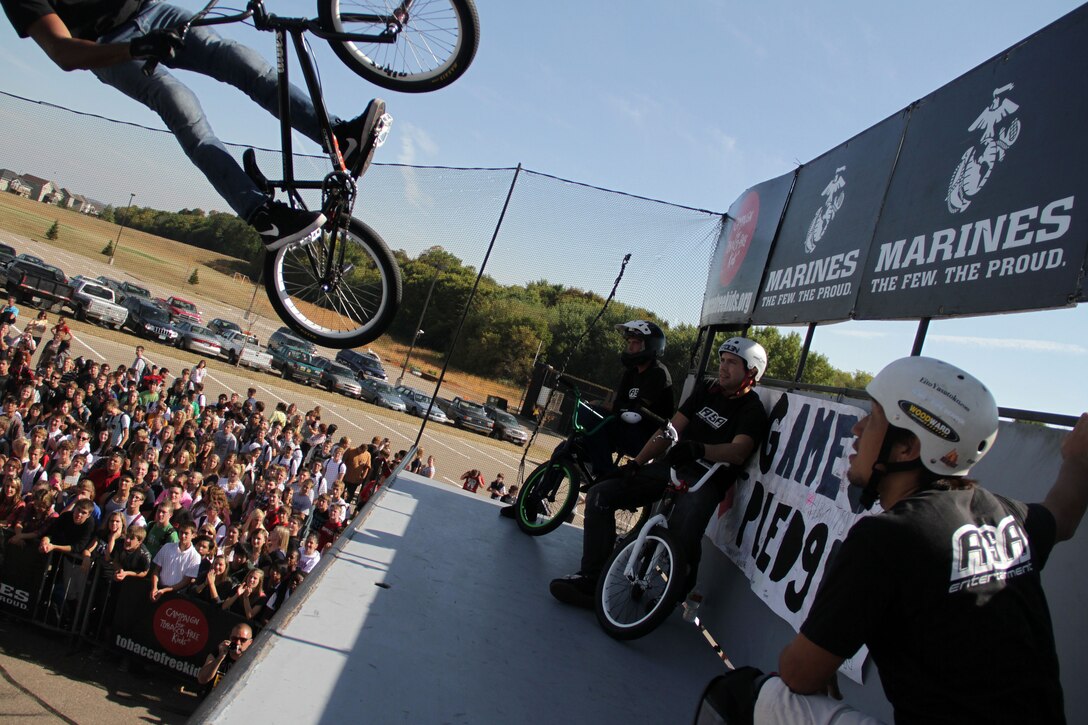 BMX biker Austin Coleman performs a stunt in front of hundreds of students at Shakopee High School Sept. 28 while Jimmy Walker, Dustin Grice and Eito Yasutoko wait for their turn to hit the half-pipe. The ASA members are some of the world’s top professional skateboarders, BMX bikers and inline skaters. For additional imagery from the event, visit www.facebook.com/rstwincities.