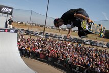 Inline skater Eito Yasutoko watches skateboarder Josh Stafford perform a trick during their Shakopee, Minn., stop on the 2011 ASA Fall High School Tour Sept. 28. The tour is an interactive “extreme” sports show that visits high schools throughout the United States with several of the world’s top professional skateboarders, BMX bikers and inline skaters delivering an anti-tobacco message. For additional imagery from the event, visit www.facebook.com/rstwincities.