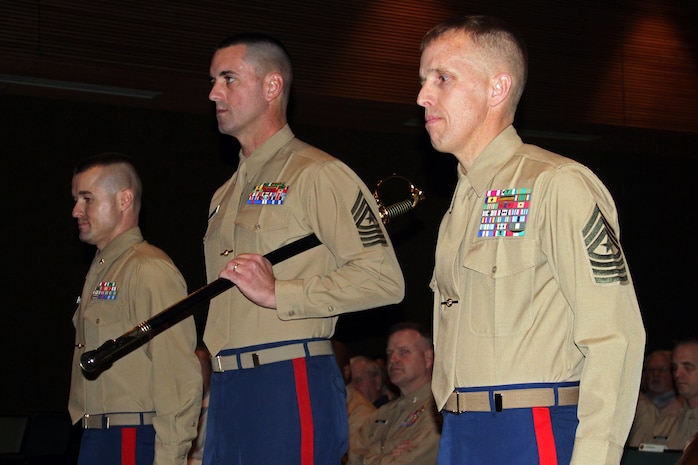 Recruiting Station Twin Cities Commanding Officer Maj. Kenneth Gawronski welcomed a new sergeant major when Sgt. Maj. James C. Kirkland (right) relinquished his post to Sgt. Maj. Sean P. Cox during a post and relief ceremony at the Fort Snelling Welcome Center March 9.