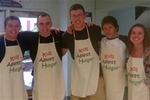 Recruiting Substation Burnsville's Patrick Massey, Sgt. Joshua Draveling, Andrew Morris, Jeremy Kaiser and Anna Albrecht set aside their hair nets for a few moments to take a photo during the Evergreen Community Church's Kids Against Hunger packing session April 14. Overall, 165 volunteers spent the day packaging more than 67,000 meals. 