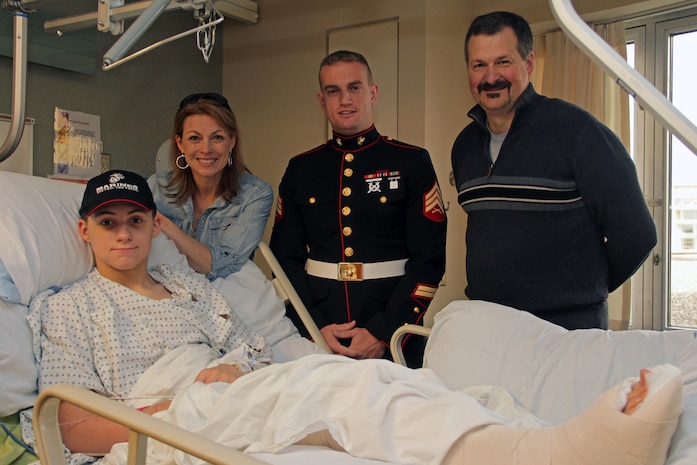 Woodbury, Minn., recruiter Sgt. Brandon Blazer, 27, from Dayton, Ohio, visits with Cathy and Gregg Patnode April 27 after their son, Luke, underwent reconstructive surgery. Luke is a 14-year-old eighth grader at Lake Middle School. Marines with Recruiting Station Twin Cities also visited Luke in 2010 after he suffered a major stroke. Luke's parents told Blazer that their son has wanted to join the Corps since he was a little kid.