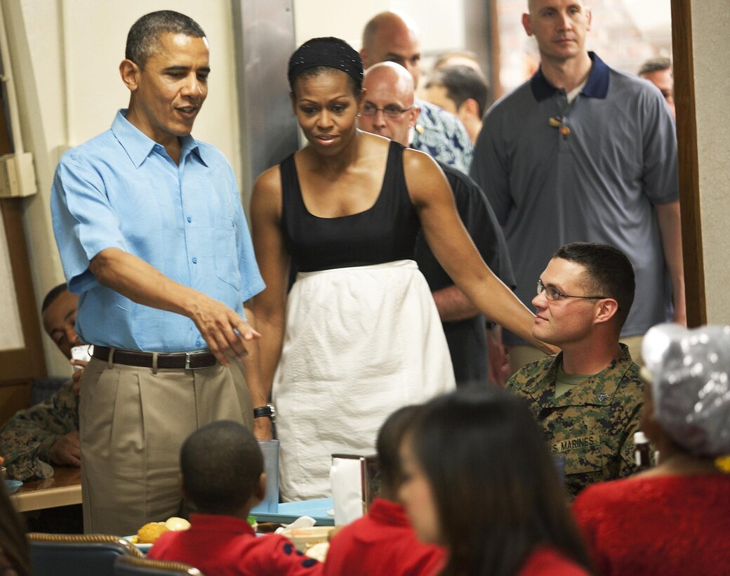 MARINE CORPS BASE HAWAII - President Barack Obama and first lady Michelle Obama greet Marines and their family members during a Christmas Day visit to Anderson Hall Dining Facility, Dec. 25. The President and his wife spent time with Marines, sailors, civilians, retirees and community members aboard Marine Corps Base Hawaii. (Official U.S. Marine Corps photo by Lance Cpl. Nathan Knapke)