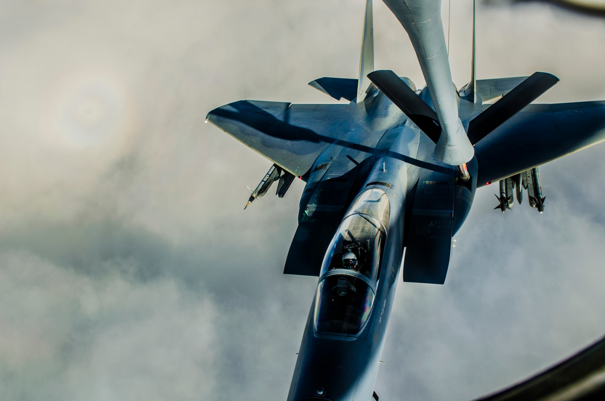 A KC-135 Stratotanker refuels an F-15 Eagle during a training sortie near Kadena Air Base, Japan, Dec. 27, 2012. The 909th Air Refueling Squadron provides combat ready KC-135 tanker aircrews to support peacetime operations in all levels of conflict in the Pacific theater. (U.S. Air Force photo/Airman 1st Class Tyler Prince)