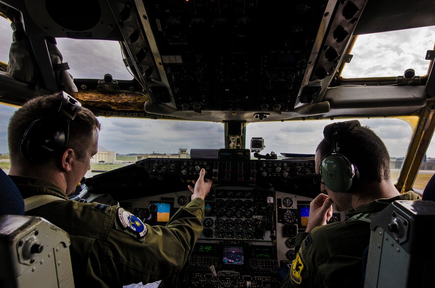 U.S. Air Force Capts. Andrew Lawerence and Harrison Gippol, 909th Air Refueling Squadron pilots, perform pre-flight checks in preparation for a training sortie on Kadena Air Base, Japan, Dec. 27, 2012. The 909th ARS provides combat ready KC-135 tanker aircrews to support peacetime operations in all levels of conflict in the Pacific theater. (U.S. Air Force photo/Airman 1st Class Tyler Prince)