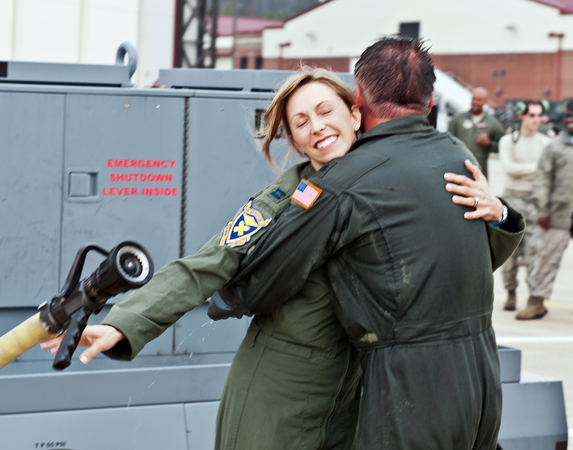 BIRMINGHAM, Ala. – Lt. Col. Darin Owens is greeted by his wife, Capt. Lauren Owens, after his fini-flight in the KC-135R. (U.S. Air Force photo by Master Sgt. David Maxwell)