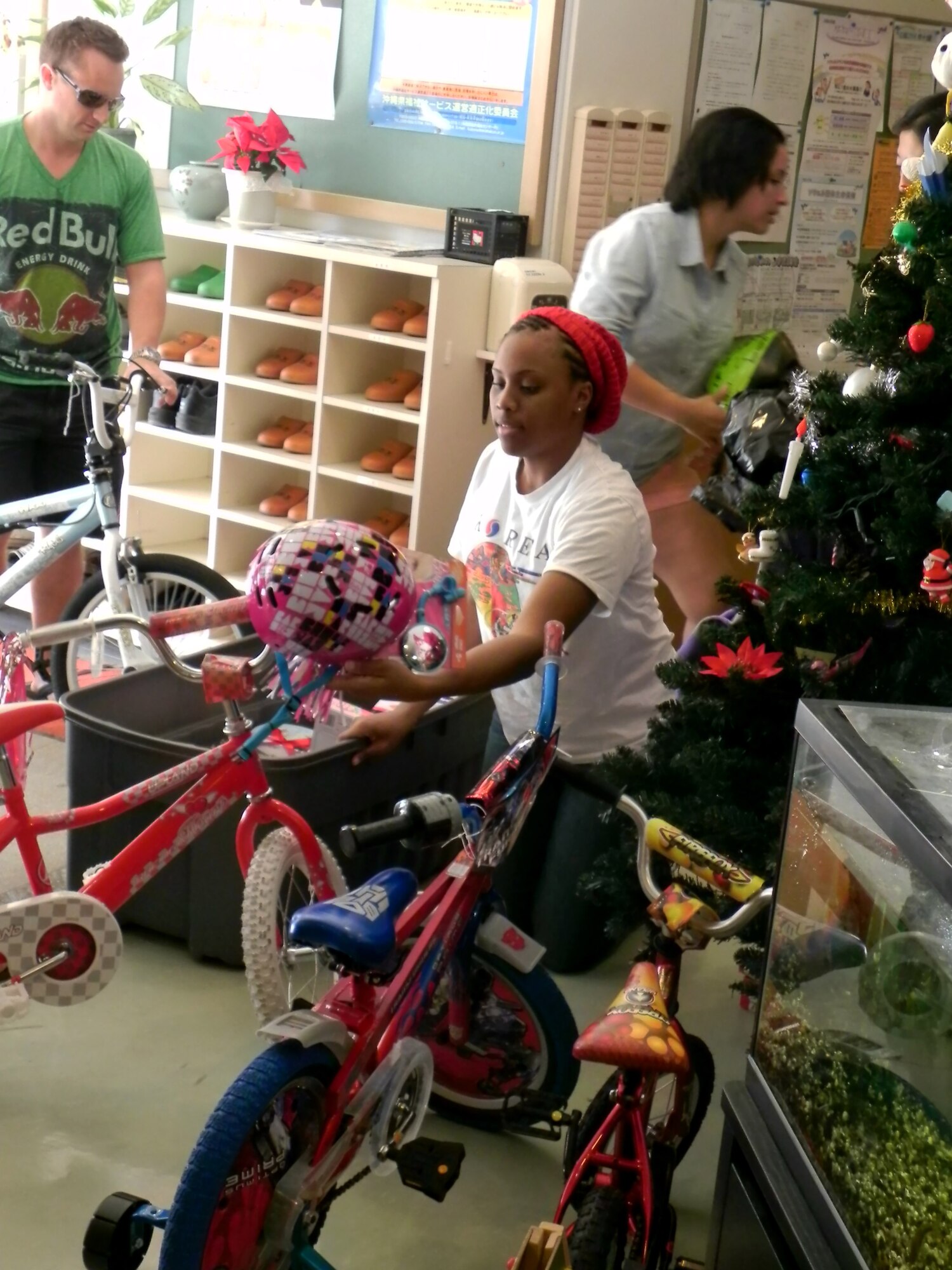 Members from the 18th Medical Group set up toys at the Ai Rin Orphanage in Okinawa, Japan, Dec. 21, 2012. The Medical Group collected more than 40 toys to give Christmas presents to children of all ages at the orphanage. (U.S. Air Force photo/Capt. Jan Kolenda)