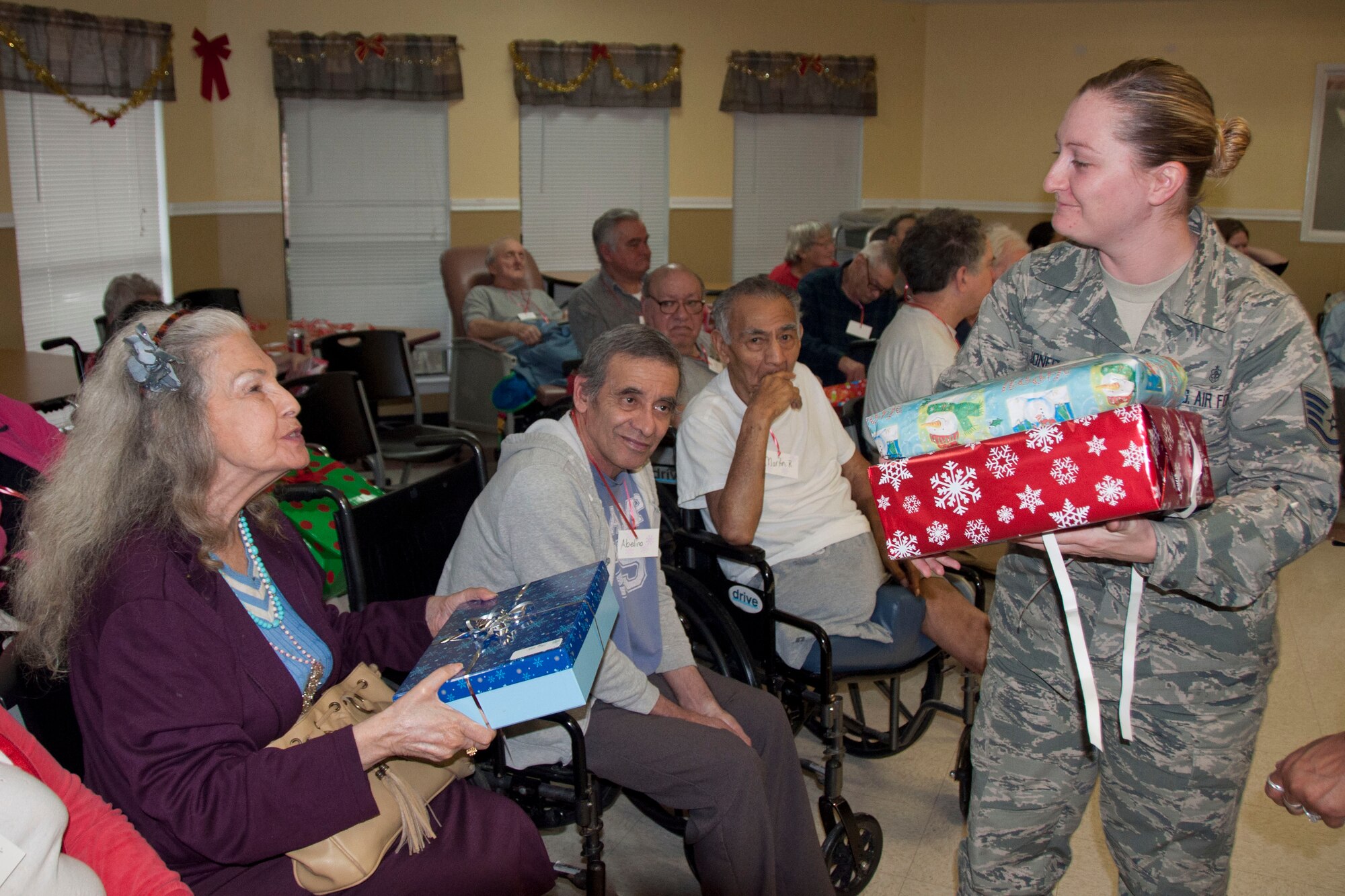 Staff Sgt. Jenny Jones, a Military Training Instructor with the 737th Training Support Squadron  was the event organizer this year. Military Training Instructors and other members of the 737th Training Group played Santa at a local skilled nursing facility delivering gifts to 84 residents this season. The 737th Training Group has been "elfing it up" with Operation Grayson Square since 1999. (U.S. Air Force Photo/Melinda Mueller) 

