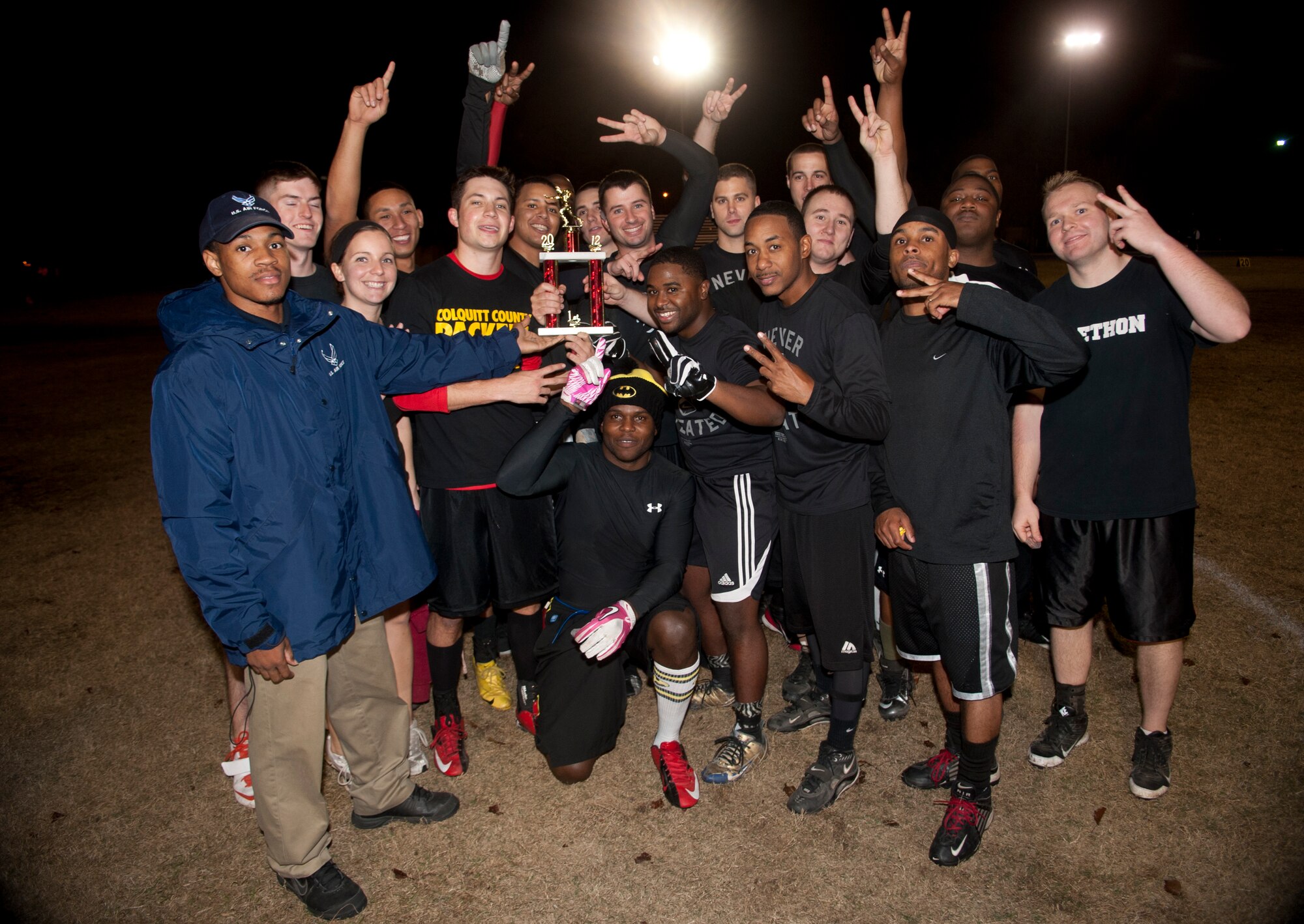 The 23d and 347th Operations Support Squadron team celebrates after winning the intramural flag football championship game at Moody Air Force Base, Ga., Dec. 18, 2012. The team won 41-6 by forcing four interceptions and returning three of them for touchdowns. (U.S. Air Force photo by Airman Paul Francis/Released)

