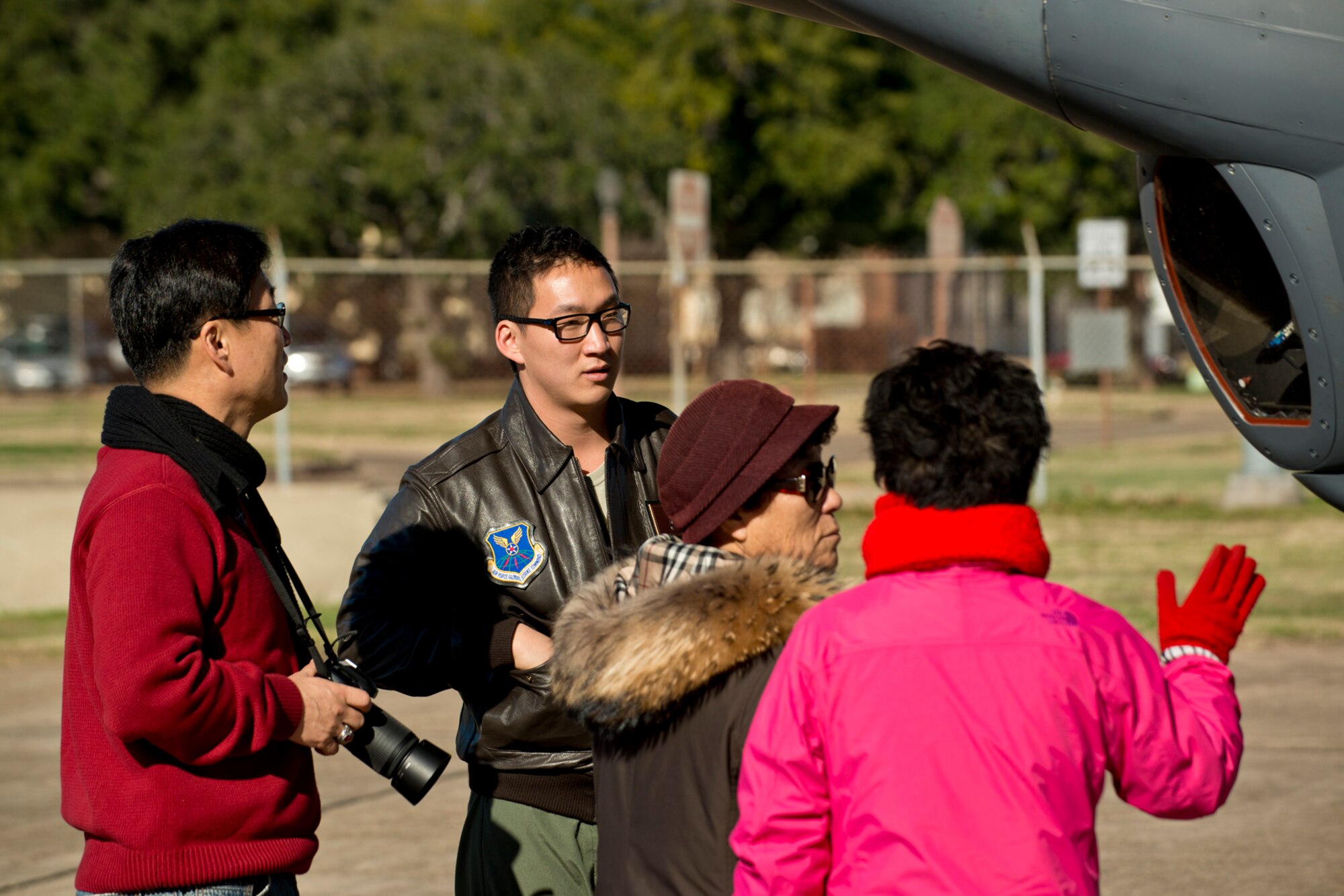 U.S. Air Force 1st Lt. Andrew Kwon gives his family a tour of a B-52H Stratofortress, Dec. 21, 2012, Barksdale Air Force Base, La. Kwon graduated from the Formal Training Unit at Barksdale, where he spent several months learning to fly the B-52. (U.S. Air Force photo by Master Sgt. Greg Steele/Released)