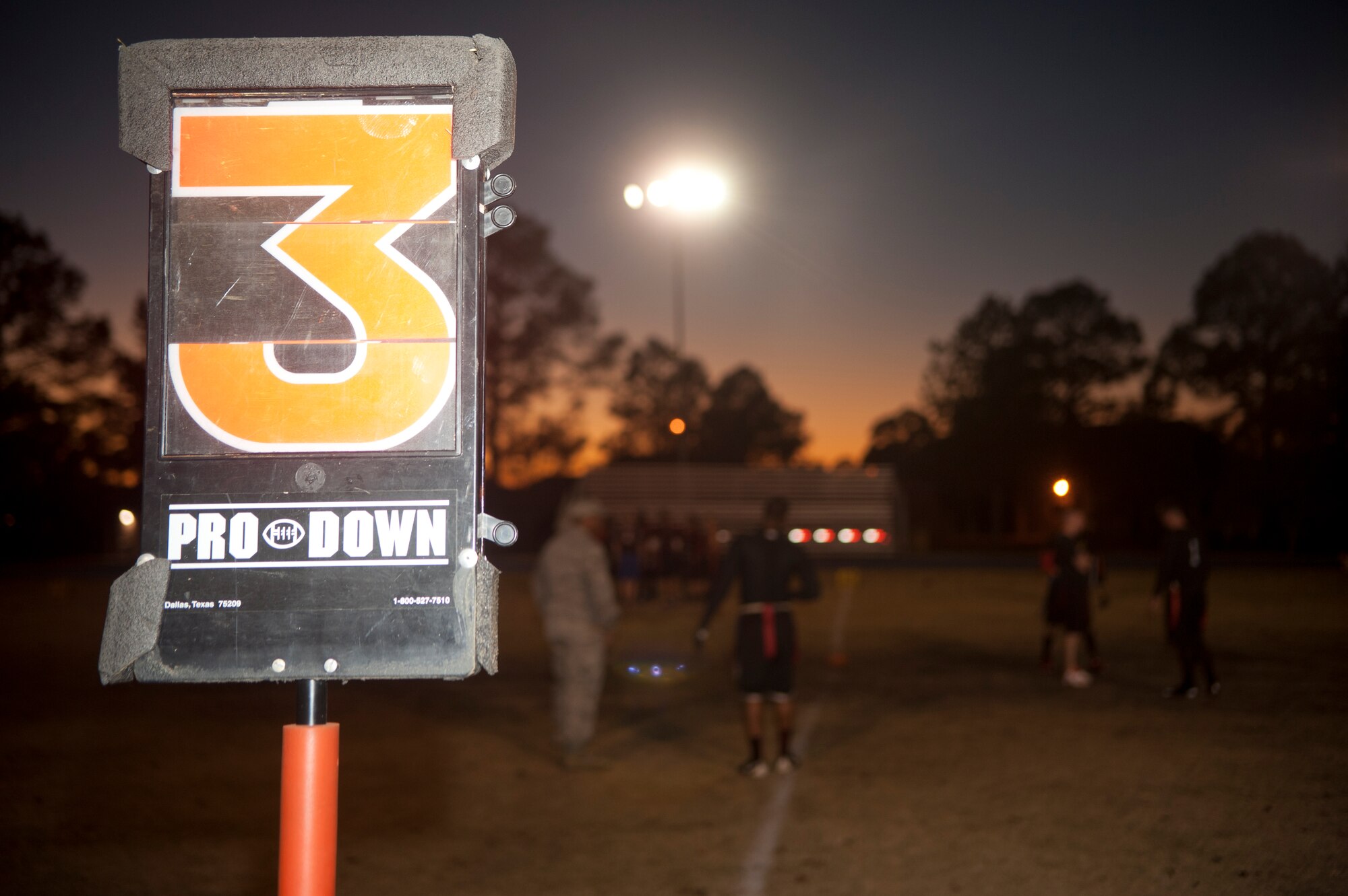 23d Medical Group attempts to move the chains on ‘third and short’ in the intramural flag football championship game at Moody Air Force Base, Ga., Dec. 18, 2012. The 23d MDG has played in the annual championship game against the combined team of the 23d and 347th Operation Support Squadrons for the last three years. (U.S. Air Force photo by Airman Paul Francis/Released) 
