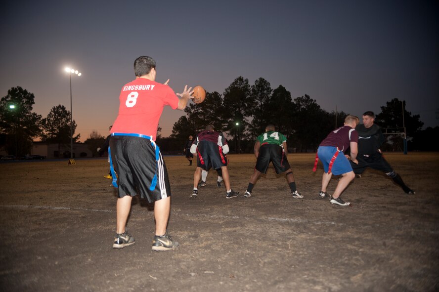 Christopher Kingsbury, 23d Medical Group quarterback, hikes the ball during an intramural flag football champion game at Moody Air Force Base, Ga., Dec. 18, 2012. The 23d MDG played against the combined team of the 23d and 347th Operations Support Squadrons, who they lost to in last year’s flag football championship. (U.S. Air Force photo by Airman Paul Francis/Released)
