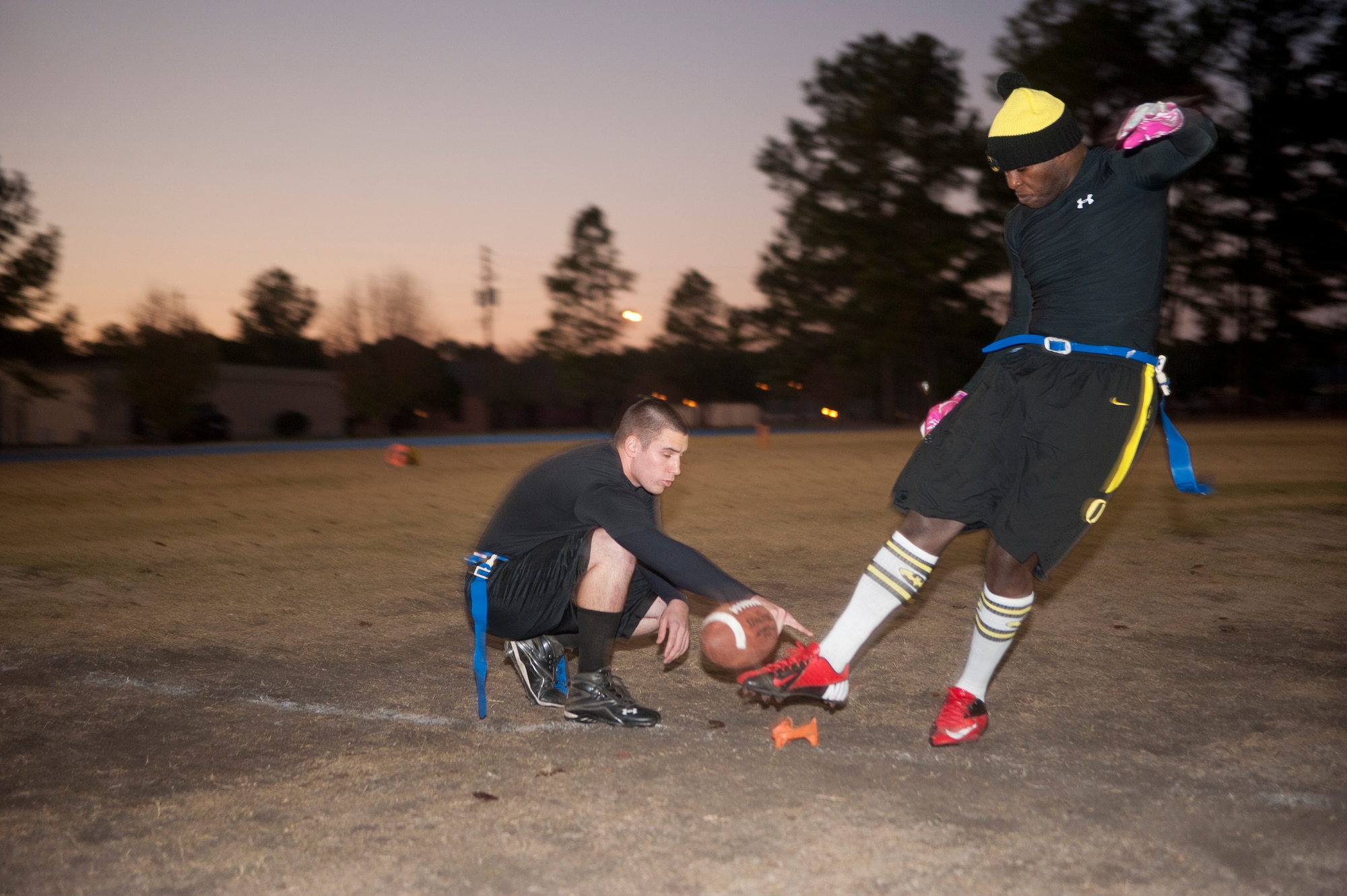 Blake Williams, 23d and 347th Operations Support Squadron member, kicks the ball to begin an intramural flag football championship game at Moody Air Force Base, Ga., Dec. 18, 2012. The combined team of the 23d and 347th OSS were the reigning champions of intramural flag football in 2011 and looked to repeat this year. (U.S. Air Force photo by Airman Paul Francis/Released)
