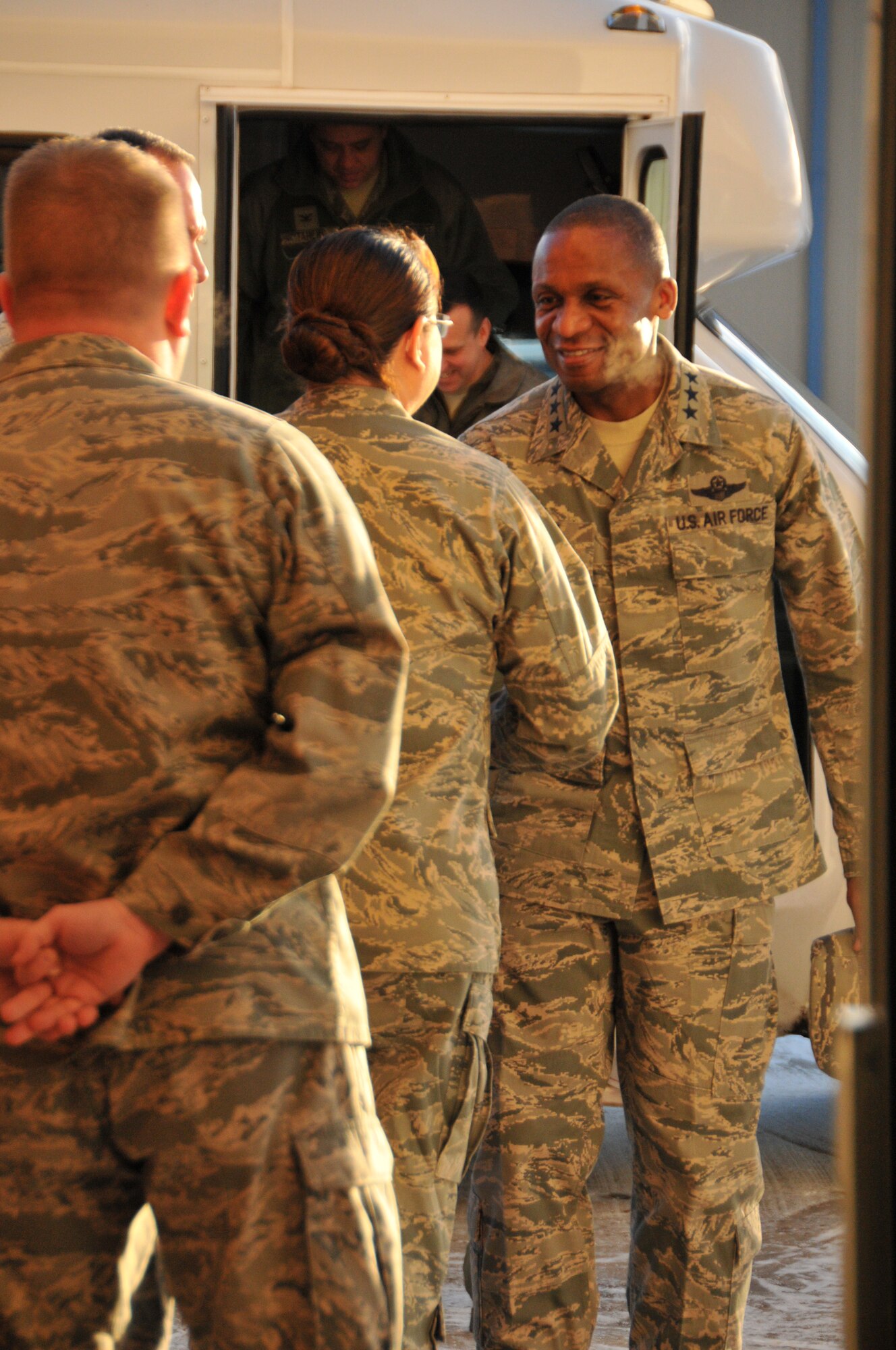 Lt. Gen. Darren W. McDew, 18th Air Force commander, shakes hands with Lt. Col. Nicole Chavez, 153rd Logistics Readiness Squadron commander, before touring  Wyoming Air National Guard facilities in Cheyenne, Wyo., Dec. 17-18, 2012. (U.S. Air Force photo by Capt. Rusty Ridley)