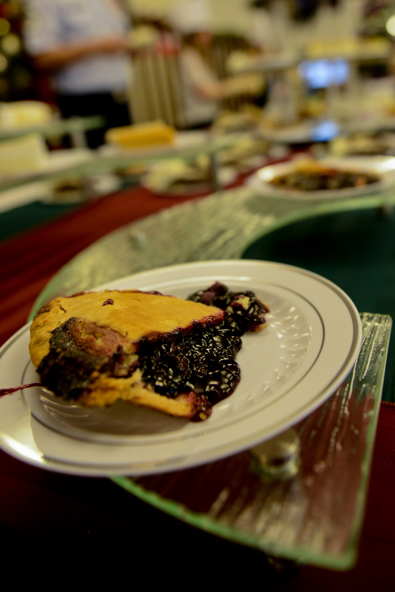 A slice of blackberry pie sits at a desert table during Christmas lunch service at the Georgia Pines Dining Facility on Moody Air Force Base, Ga., Dec. 25, 2012. The lunch service offered all of the fixings for a traditional Christmas dinner as well as a variety of desserts for visitors to partake in. (U.S. Air Force photo by Staff Sgt. Joshua J. Garcia/Released)  