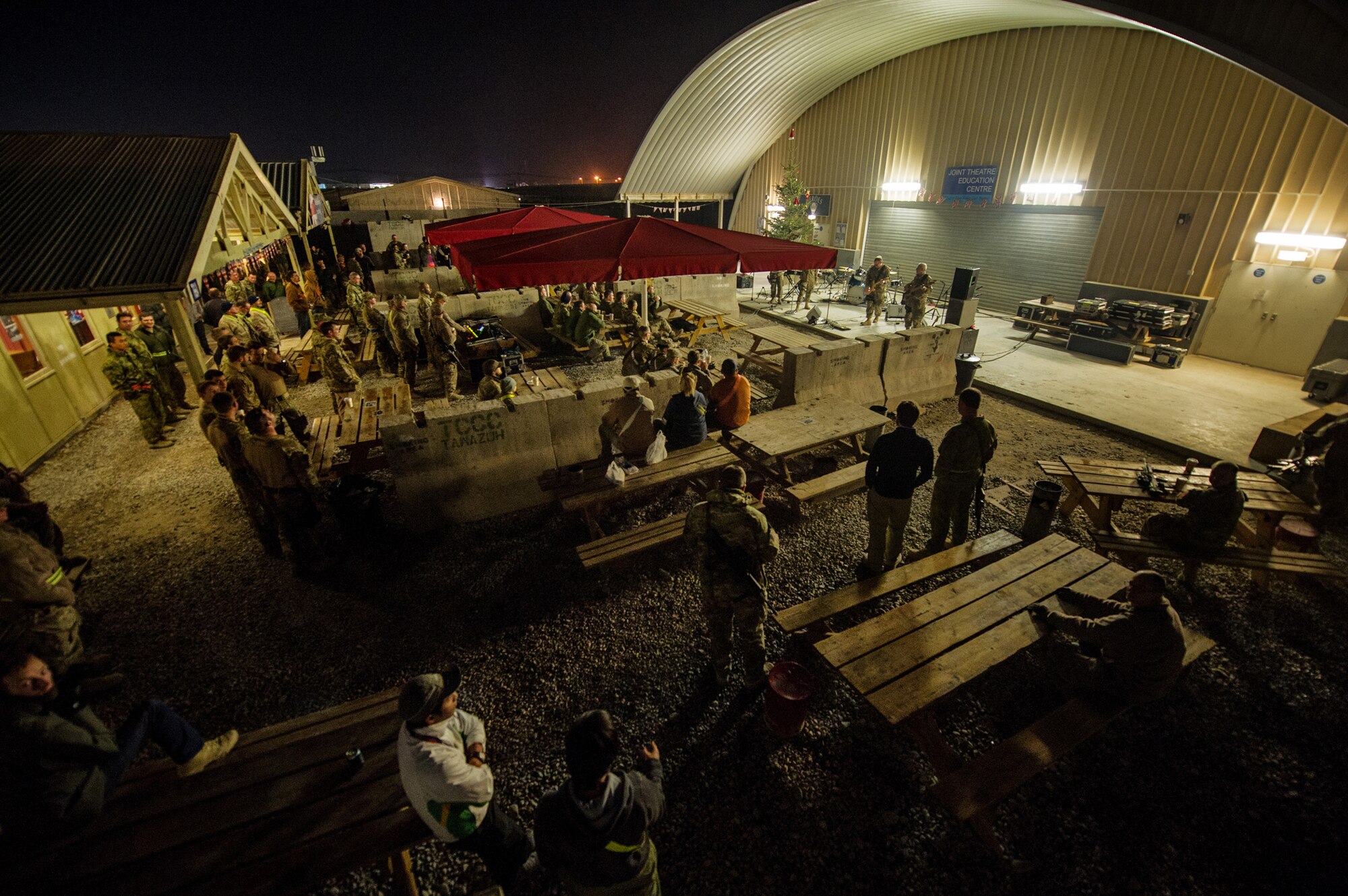 Coalition forces enjoy the concert put on by the U.S. Air Forces Central Band "Total Force," Dec. 20, 2012, at Kandahar Airfield, Afghanistan. The band is on tour around Afghanistan during the holiday season to entertain deployed service members. (U.S. Air Force photo/Staff Sgt. Jonathan Snyder)