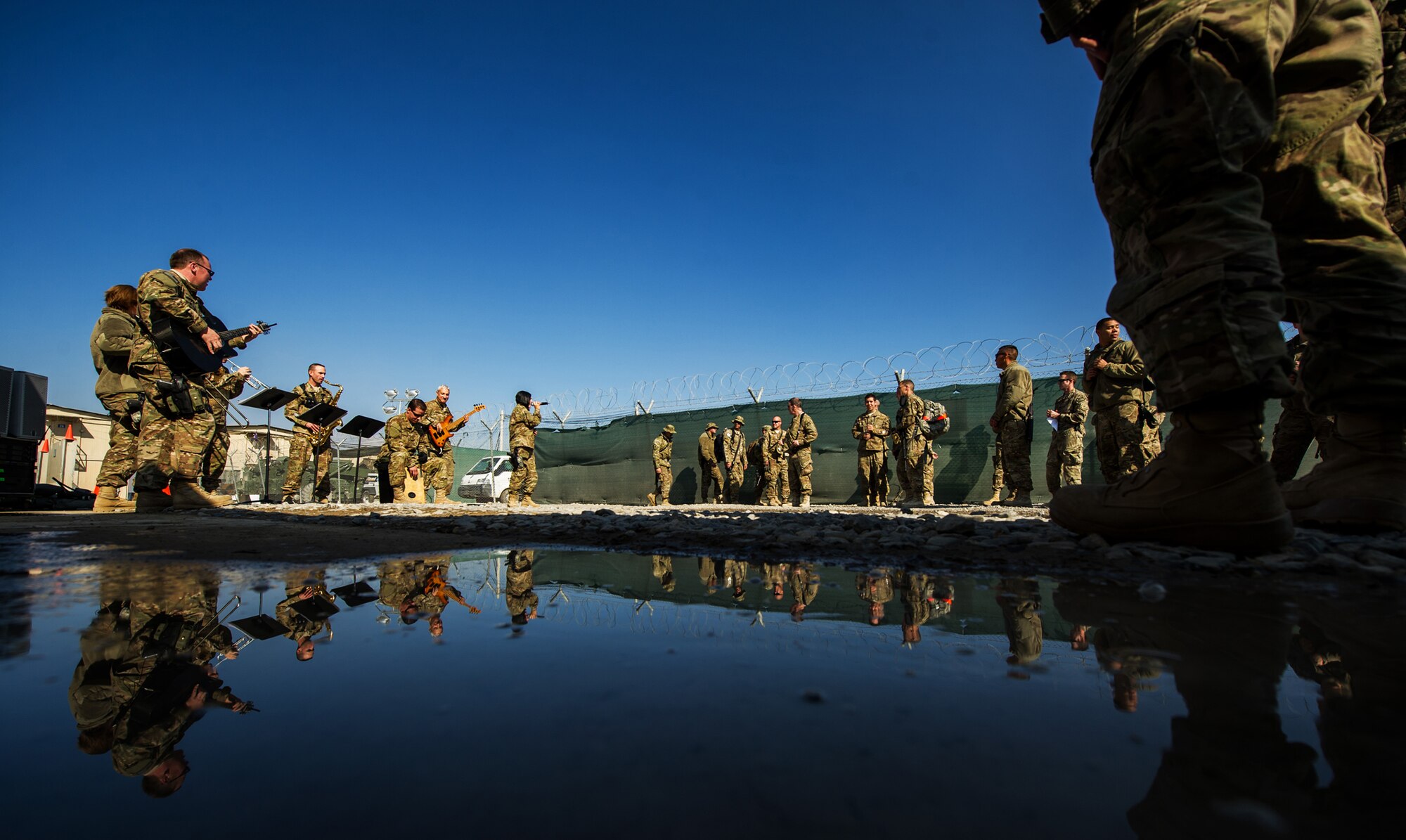 U.S. Air Forces Central Band "Total Force", performs for the 451st Expeditionary Logistic Readiness Squadron Dec. 19, 2012, at Kandahar Airfield, Afghanistan. The band had a chance to tour around base playing at several different work centers. (U.S. Air Force photo/Staff Sgt. Jonathan Snyder)