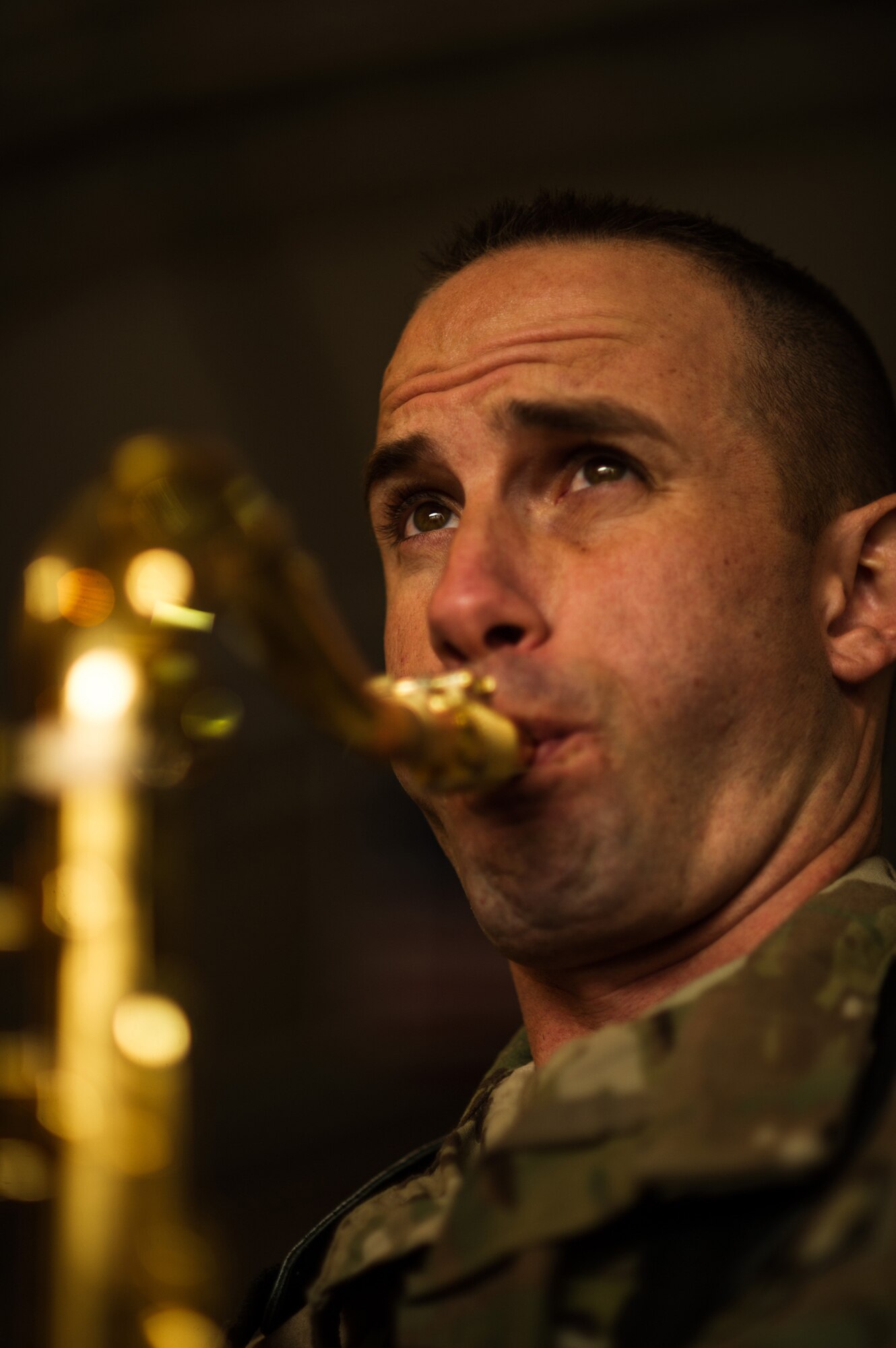 U.S. Army Staff Sgt. Christopher Lawrence, U.S. Air Forces Central Band "Total Force", plays the saxophone during a performance for the 451st Expeditionary Logistic Readiness Squadron Dec. 19, 2012, at Kandahar Airfield, Afghanistan. The band had a chance to tour around base playing at several different work centers. Lawrence's hometown is Tahlequah, Okla. (U.S. Air Force photo/Staff Sgt. Jonathan Snyder)