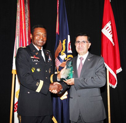 U.S. Army Corps of Engineers Commanding General Lt. Gen. Thomas Bostick presents the Sustainability Hero Award to Dr. Ilker Adiguzel, ERDC Construction Engineering Research Laboratory.