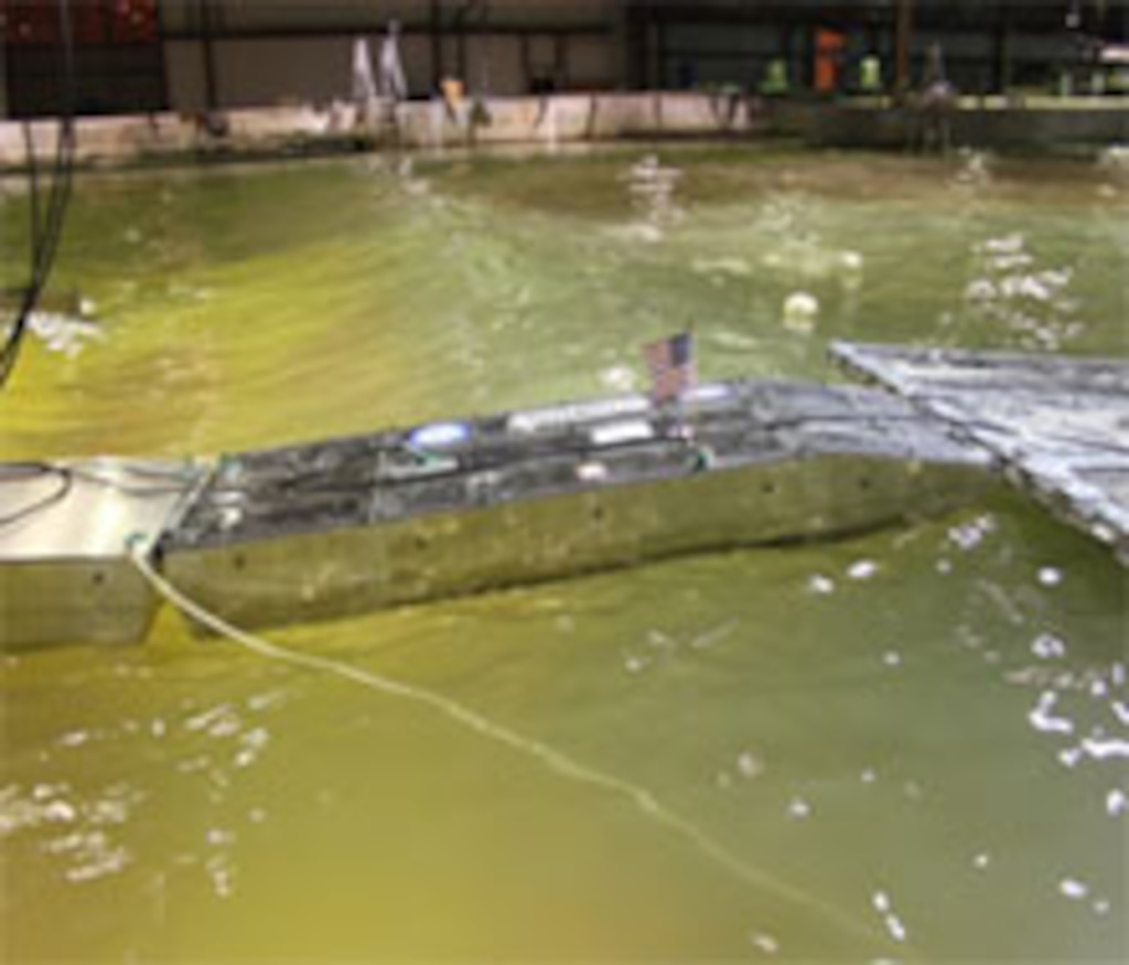 The scaled model testing at ERDC's Coastal and Hydraulics Laboratory was conducted to investigate the behavior of the Joint Universal Causeway Interface Module in a simulated ocean environment. 